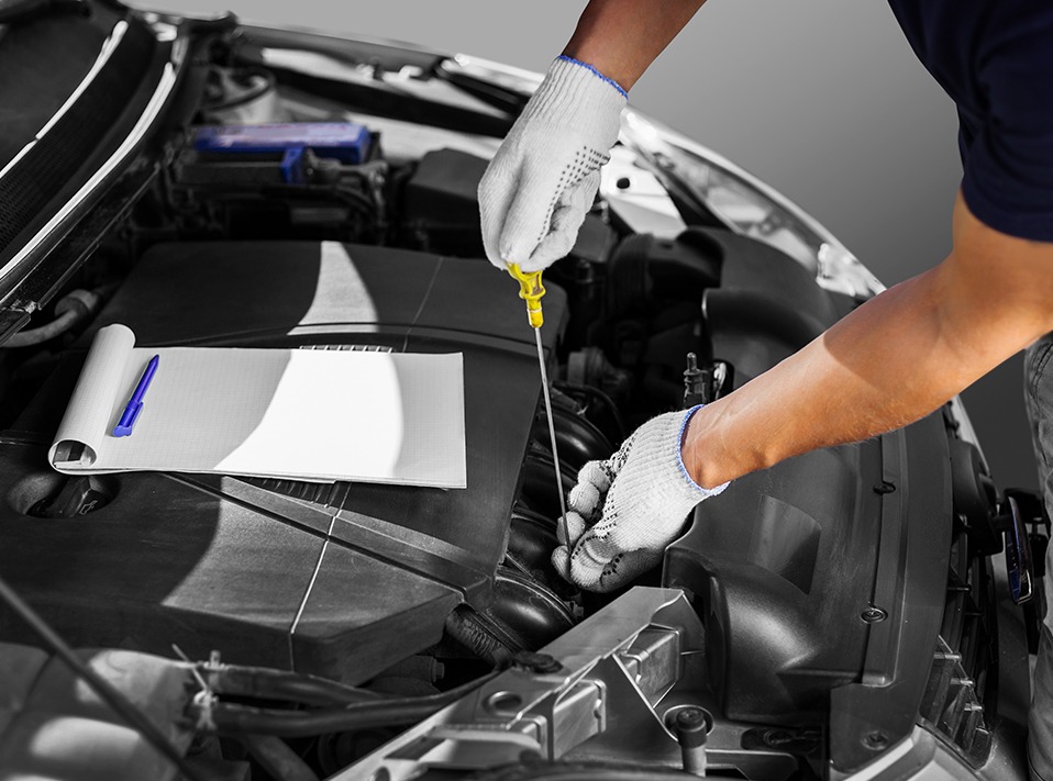 Mechanic changing engine oil - Vehicle Servicing Havant